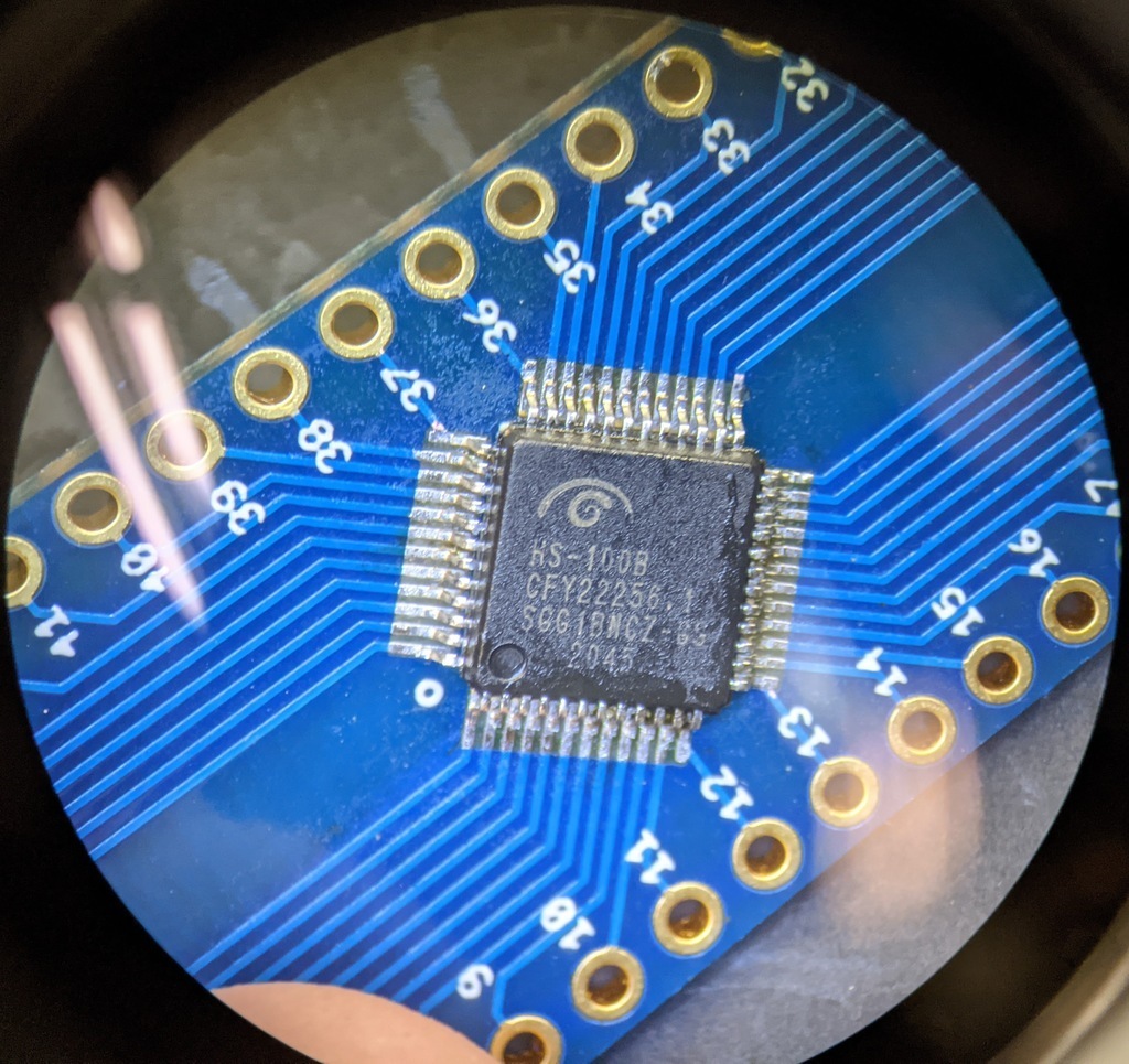 QFP microchip through a microscope